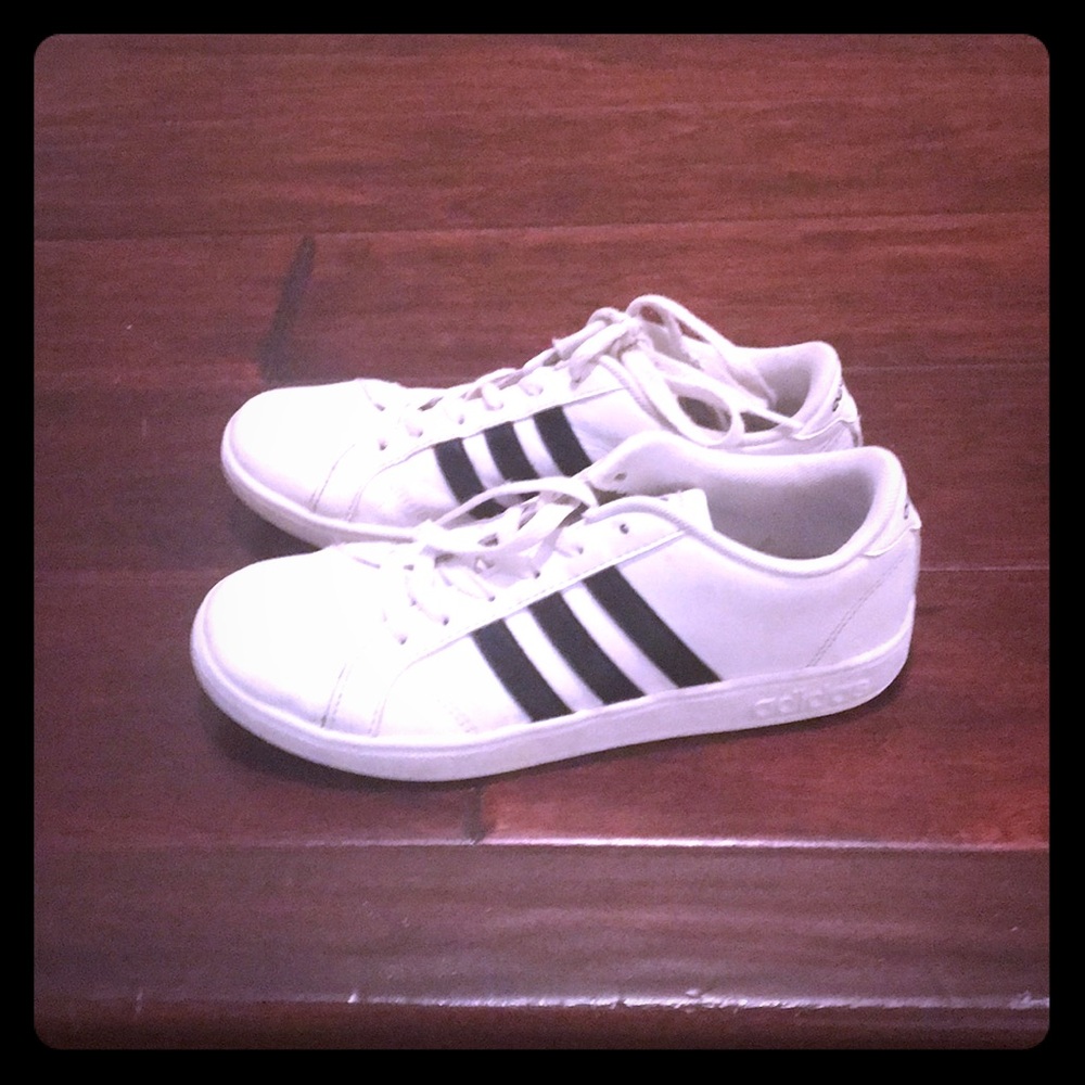 Girls white adidas sneakers with black stripes